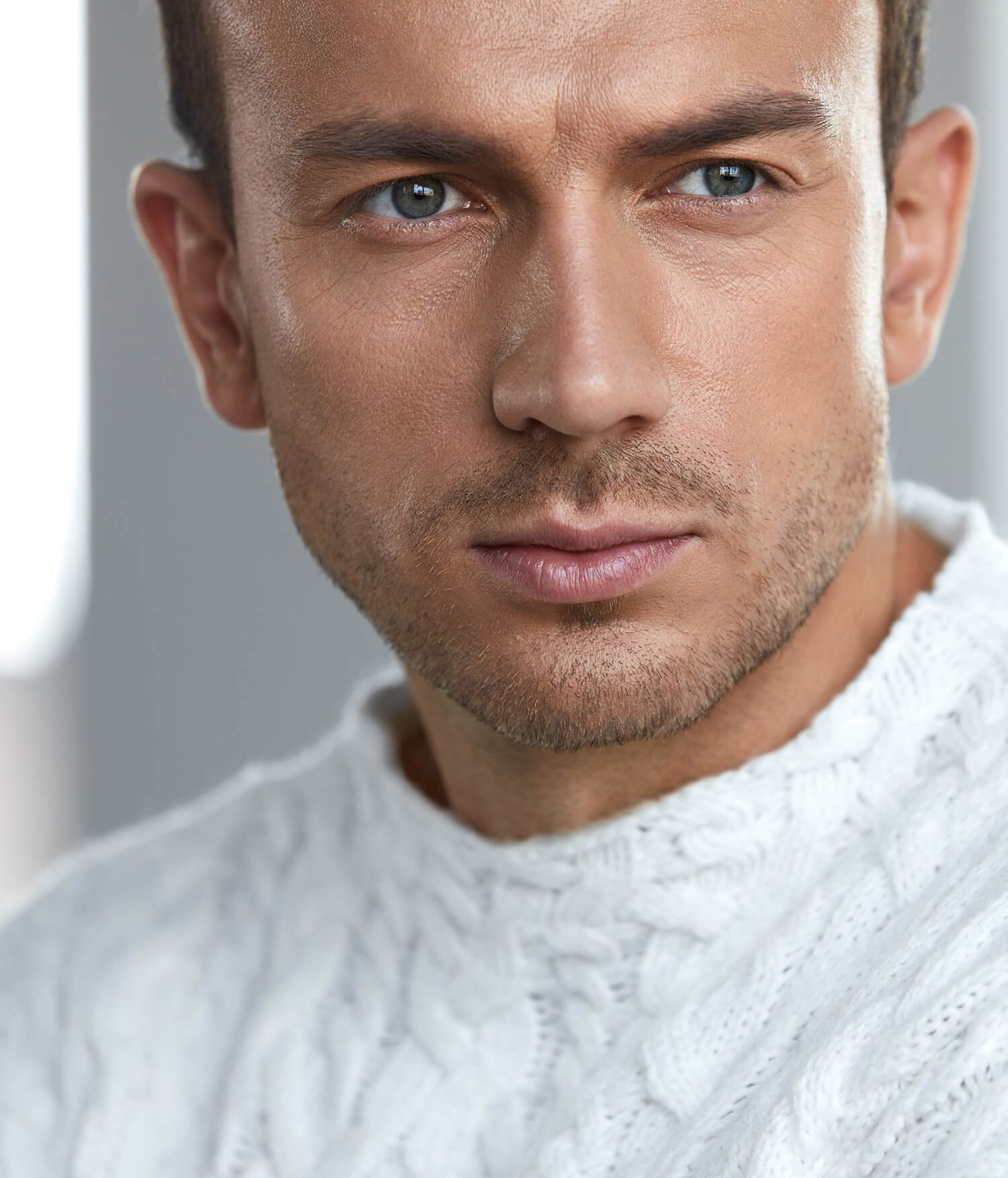 male Cosmetic Dermatology Orange County patient model with a white shirt