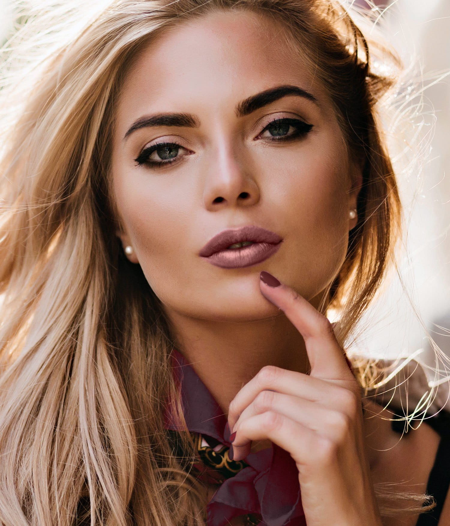 blonde Newport Beach Cosmetic Dermatology patient model with pink lipstick